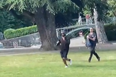 A screengrab taken from a video shows a man armed with a knife running away after he attacked a group of pre-school children. AFP 
