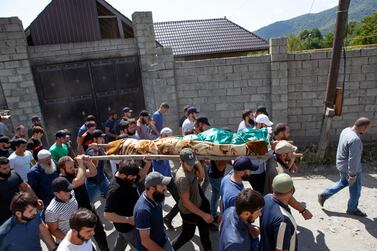 The funeral of Zelimkhan Khangoshvili in Georgia after his killing in Berlin that has been linked to the Russian state. AP