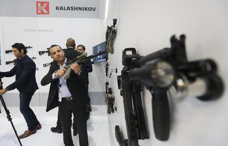 Visitors at the Kalashnikov stand. The world’s most famous assault rifle could be made in the UAE under plans being considered by its owner. Satish Kumar / The National
