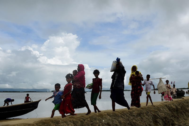 Rohingya Muslim refugees arrive from Myanmar after crossing the Naf river in the Bangladeshi town of Teknaf.
Munir Uz Zaman / AFP Photo