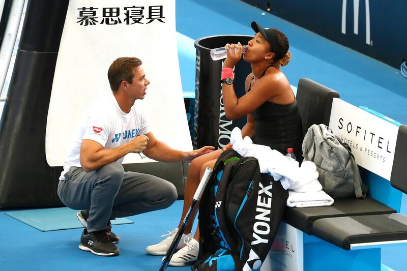 FILE PHOTO: Tennis - Brisbane International - Women's Quarter Finals - Pat Rafter Arena, Brisbane, Australia, January 3, 2019   Japan's Naomi Osaka with coach Sascha Bajin before her match against Latvia's Anastasija Sevastova   REUTERS/Patrick Hamilton/File Photo