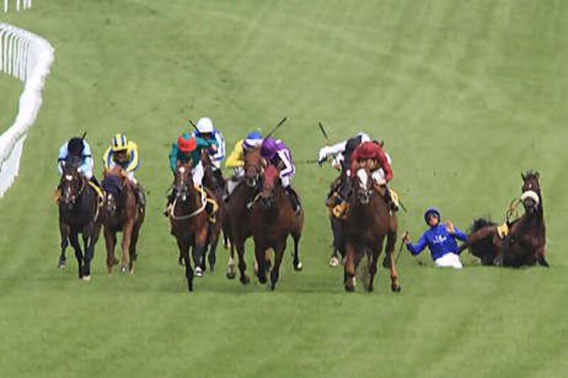 Frankie Dettori and Film Score, right, come to grief in the Gordon Stakes on the opening day of Glorious Goodwood.
