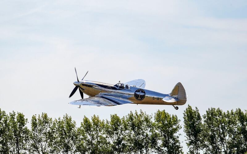 A restored MK IX Spitfire takes off from Goodwood Aerodrome in Goodwood, England on Monday. Steve Parsons /  PA