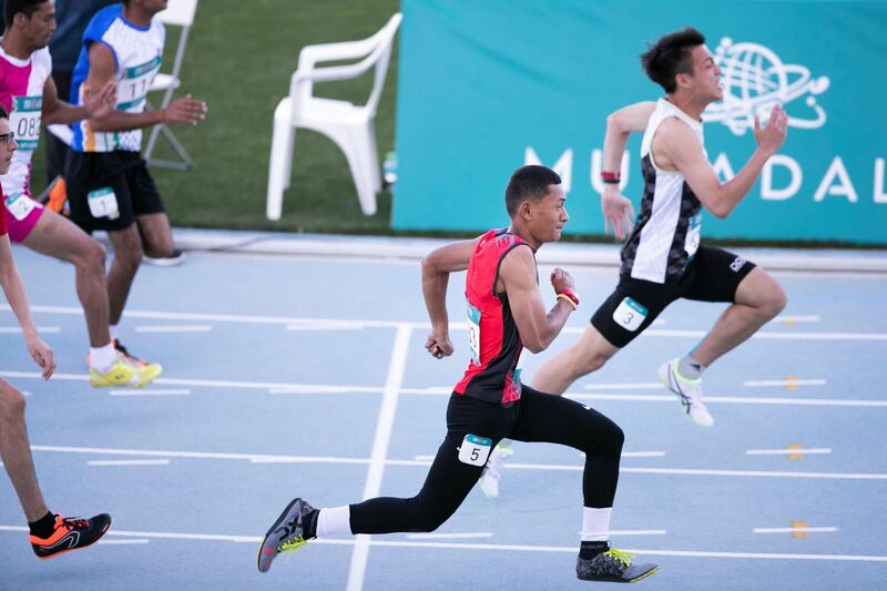 DUBAI, UNITED ARAB EMIRATES - March 19 2019.

ANZAC IOSIA ANDY STEVE LEITU, left, from American Samoa wins gold at the Special Olympics World Games athletics competition in Dubai Police Academy Stadium.

 (Photo by Reem Mohammed/The National)

Reporter: 
Section:  NA