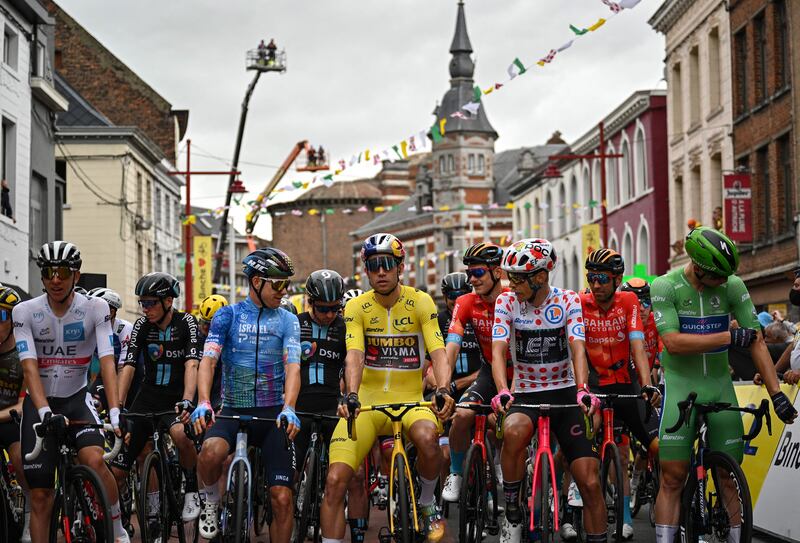 UAE Team Emirates rider Tadej Pogacar, left, wearing the best young rider's white jersey, at the start of the sixth stage of the Tour de France. AFP