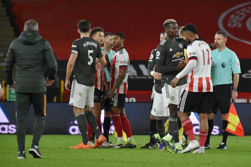 SHEFFIELD, ENGLAND - DECEMBER 17: Paul Pogba of Manchester United interacts with Lys Mousset of Sheffield United following the Premier League match between Sheffield United and Manchester United at Bramall Lane on December 17, 2020 in Sheffield, England. The match will be played without fans, behind closed doors as a Covid-19 precaution.  (Photo by Rui Vieira - Pool/Getty Images)
