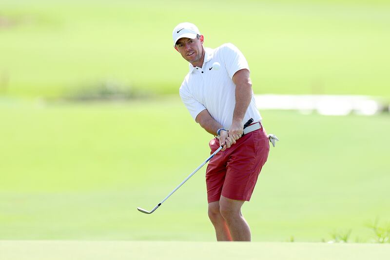 Rory McIlroy plays a chip on the 18th hole during the DP World Tour Championship Rolex Pro-AM. Getty 