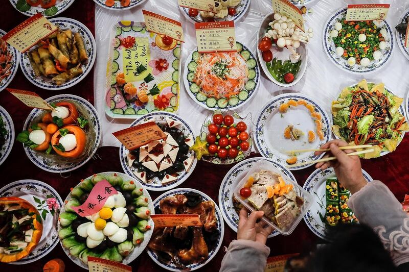 WUHAN, CHINA - FEBRUARY 09:  Homemade dishes sit on a table during a Lunar New Year gathering on February 9, 2018 in Wuhan, Hubei province, China. Community residents cook thousands of dishes and invite neighbours to have a taste, learn from others' cooking skills and to send blessing to each other on the 23rd or 24th days of the 12th month of the Chinese lunar year.(Photo by Wang He/Getty Images)