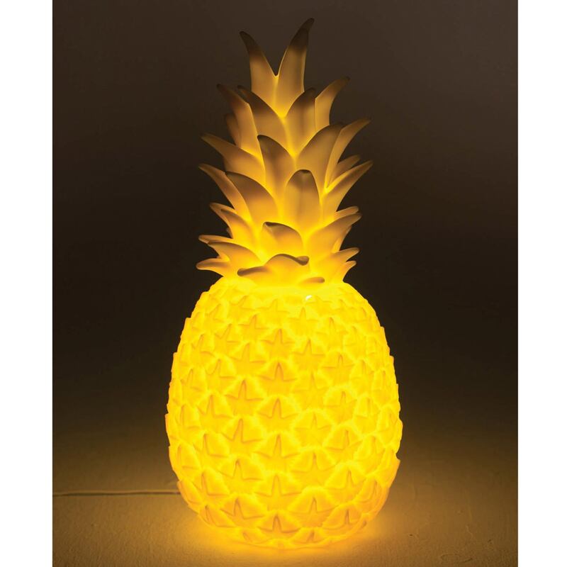 Pineapple yellow, or indeed pineapple-shaped accessories, will give your space a tropical vibe. Seen here, the Pina Colada lamp from Yellow Octopus