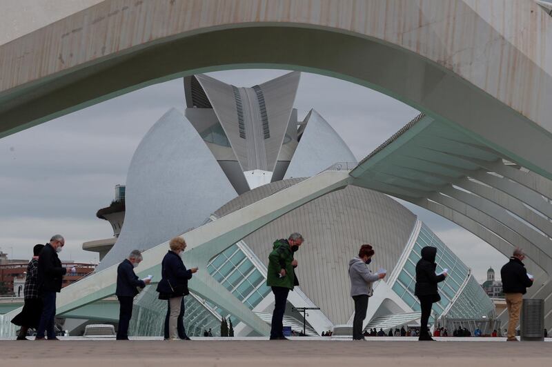 People queue at the vaccination center at the Sciences City in Valencia, eastern Spain. EPA