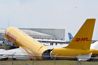 A DHL cargo plane is seen after emergency landing at the Juan Santa Maria international airport due to a mechanical problem, in Alajuela, Costa Rica, on April 7, 2022. AFP