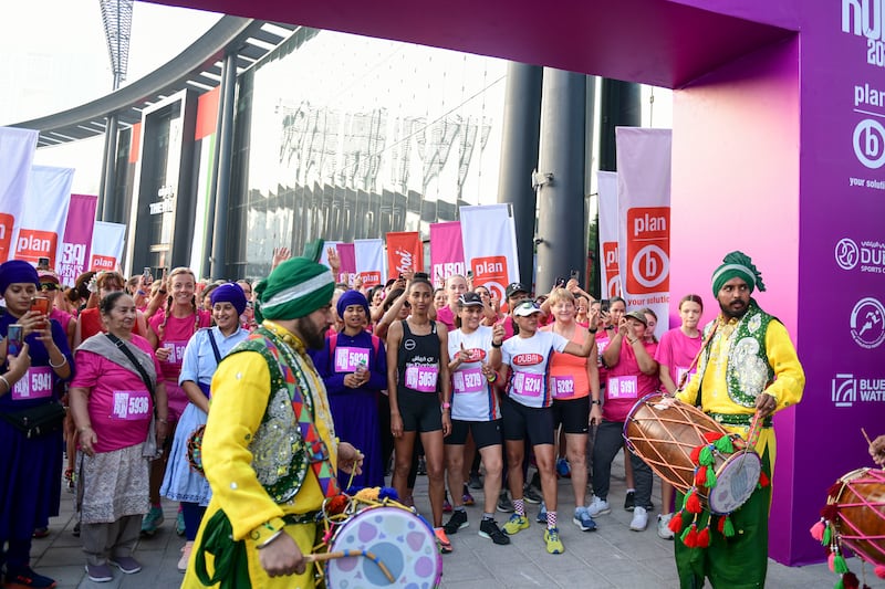 A dhol group performs before the 5km run at the Dubai Women's Run. 

