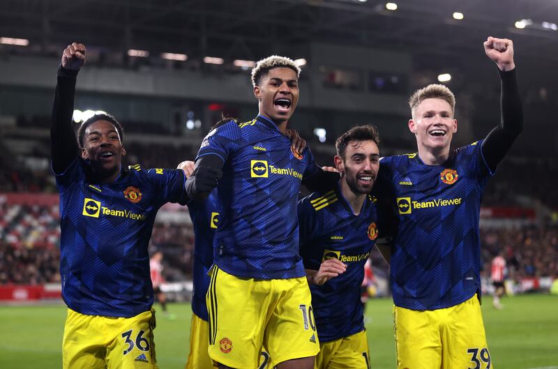 Marcus Rashford of Manchester United celebrates with teammates Anthony Elanga, Bruno Fernandes and Scott McTominay. Getty