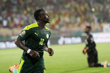 Senegal's Sadio Mane celebrates after scoring his side's third goal during the African Cup of Nations 2022 semi-final soccer match between Burkina Faso and Senegal at the Ahmadou Ahidjo stadium in Yaounde, Cameroon, Wednesday, Feb.  2, 2022.  (AP Photo / Sunday Alamba)
