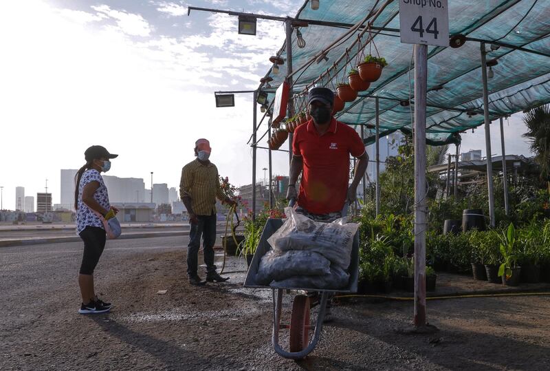 Abu Dhabi, United Arab Emirates, November 28, 2020.  The surrounding areas the morning after the demolition of the Mina Zayed Plaza.   Vendors at the Plant Market tidy up their stalls the morning after.
Victor Besa/The National
Section:  National News