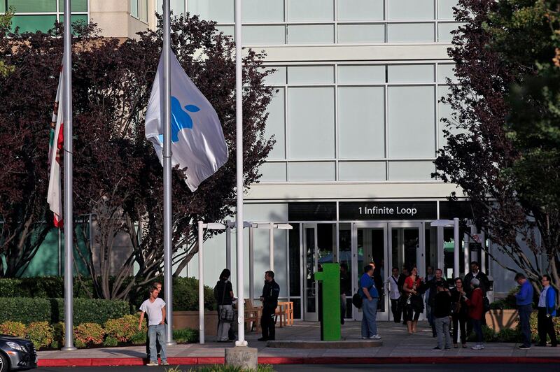 Flags fly at half staff following the death of Steve Jobs at Apple headquarters Wednesday, Oct. 5, 2011 in Cupertino, Calif. Jobs, the Apple founder and former CEO who invented and masterfully marketed ever-sleeker gadgets that transformed everyday technology, from the personal computer to the iPod and iPhone, has died. He was 56. (AP Photo/Marcio Jose Sanchez) *** Local Caption ***  Obit Jobs.JPEG-02aa5.jpg