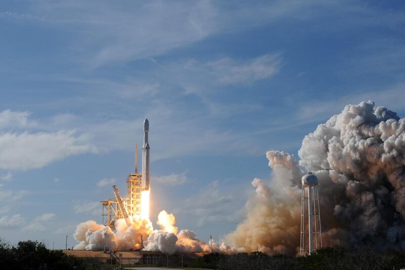 The SpaceX Falcon Heavy launches from Pad 39A at the Kennedy Space Center in Florida, on February 6, 2018, on its demonstration mission.
The world's most powerful rocket, SpaceX's Falcon Heavy, blasted off Tuesday on its highly anticipated maiden test flight, carrying CEO Elon Musk's cherry red Tesla roadster to an orbit near Mars. Screams and cheers erupted at Cape Canaveral, Florida as the massive rocket fired its 27 engines and rumbled into the blue sky over the same NASA launchpad that served as a base for the US missions to Moon four decades ago.
 / AFP PHOTO / JIM WATSON