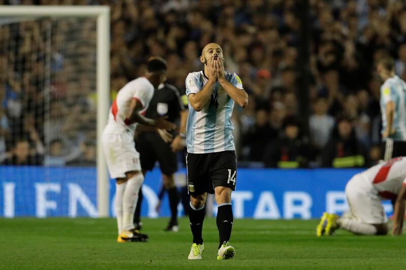 Javier Mascherano reacts after missing a goal-scoring chance. Victor R Caivano / AP Photo