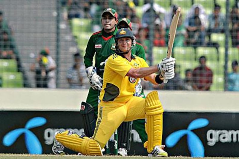 Australia's Shane Watson smashes one of his 15 sixes in Dhaka. Mir Farid / AP Photo