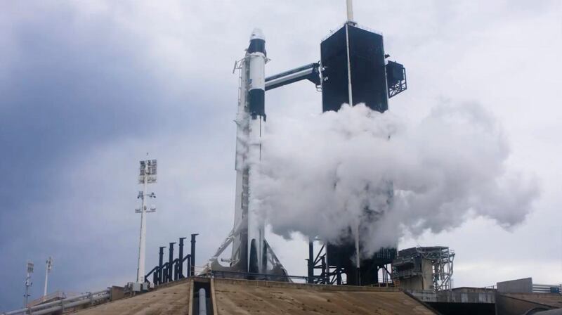 Liquid oxygen vents off the Falcon 9 rocket moments before the mission was aborted due to weather problems. AP