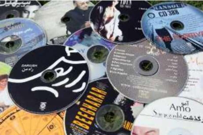 September 9, 2008 / Dubai /  Iman Attazardeh a former DJ still has a collection of hundreds of Iranian CDs September 9, 2008. (Sammy Dallal / The National) 



 *** Local Caption ***  sd-dj3.jpg