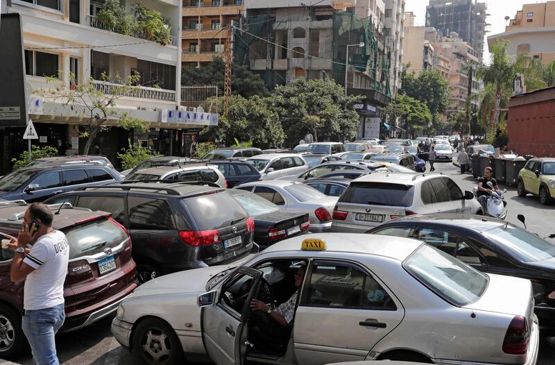 Motorists wait in a queue outside a closed petrol station in Beirut. Lebanon's central bank has been  struggling to secure foreign currency to import fuel. AFP