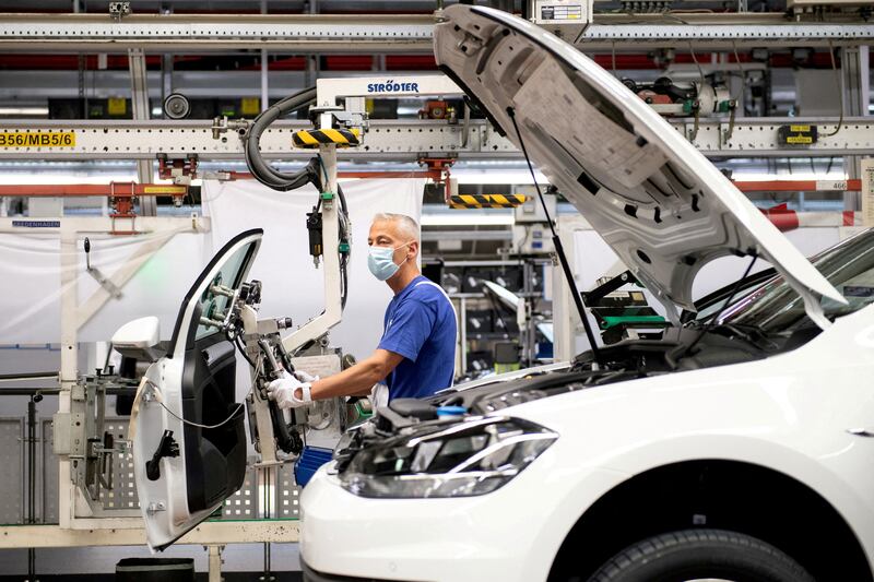 A worker wears a protective mask on the Volkswagen assembly line. Reuters