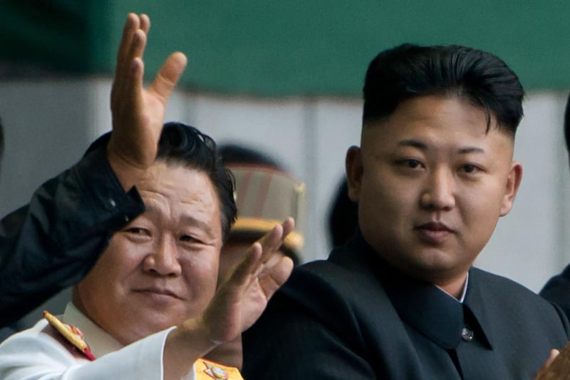 (FILES) In a file photo taken on July 26, 2013 North Korean leader Kim Jong Un (C) stands beside Workers Party of Korea (WPK) politburo standing committee member Choe Ryong Hae (L) prior to an mass games display at the Rungnado May Day Stadium in Pyongyang. Pyongyang has replaced its nominal head of state, a role in charge of representing Pyongyang in international engagements, the North's state media reported April 12. Kim Yong Nam, who had been holding the position for almost 20 years, was replaced by Choe Ryong Hae during the first session of the 14th Supreme People's Assembly, KCNA said.
 - 
 / AFP / Ed JONES
