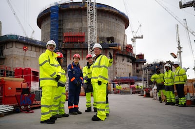 Labour leader Keir Starmer, centre right, meets workers at Hinkley Point nuclear power station. PA