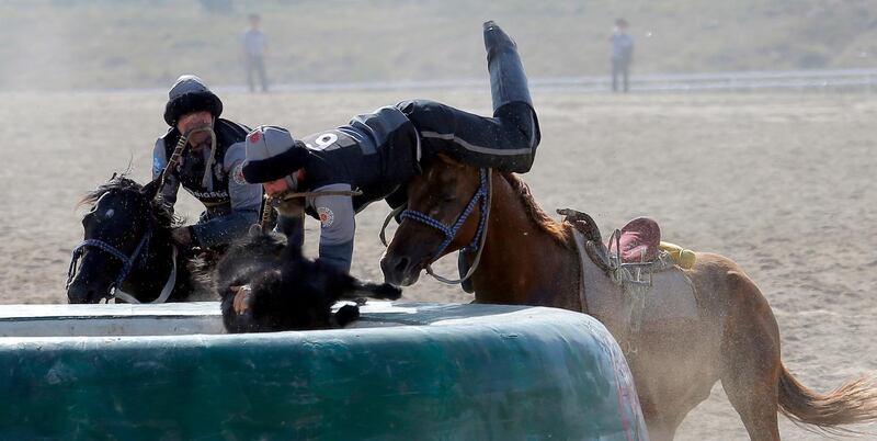 Kazakh and US horsemen take part in kok-boru. EPA