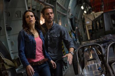 A handout photo of Mia (JORDANA BREWSTER) and Brian (PAUL WALKER) make a break for it in "Fast & Furious 6", the next installment of the global blockbuster franchise built on speed. (Photo by Giles Keyte) *** Local Caption ***  AL24OC-HOLLY-FAST7.jpg