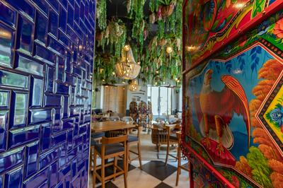 The vibrant decor at Little Miss India transports you to the country, with motifs of monuments and mythical birds. Chris Whiteoak / The National