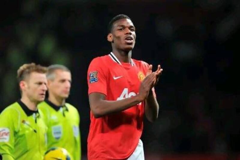 Manchester United's Paul Pogba celebrates after the final whistle