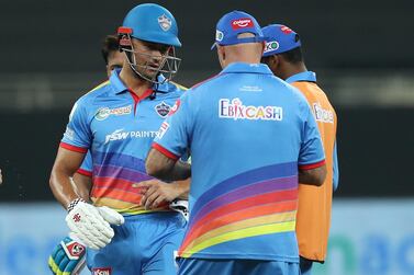 Delhi Capitals' Marcus Stoinis receives treatment after being hit by a beamer from Bangalore pacer Navdeep Saini. Sportzpics for BCCI