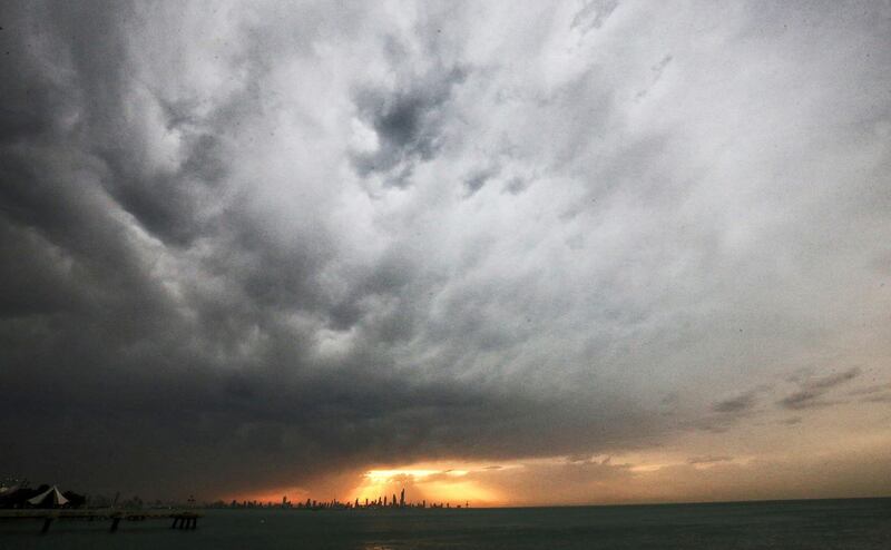 Clouds loom over Kuwait City at sunset. AFP