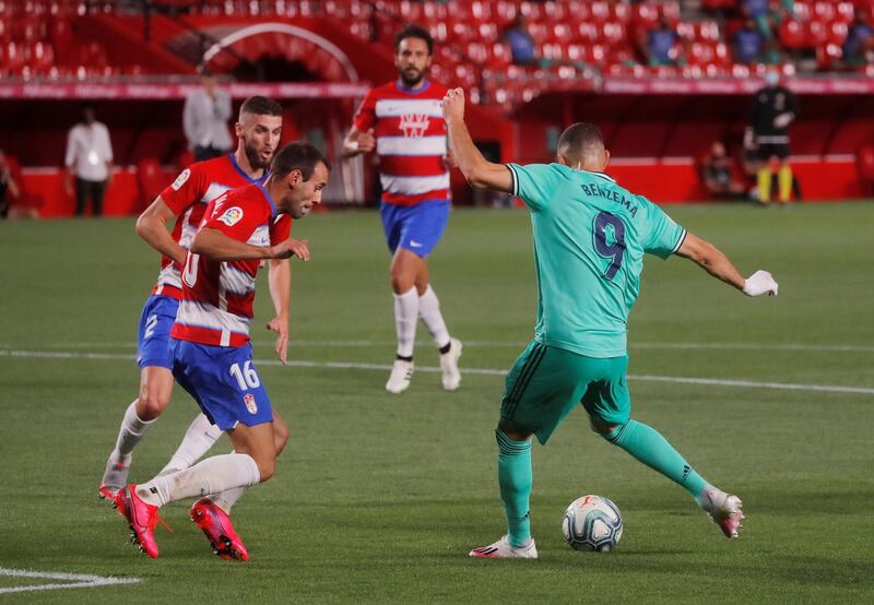 Karim Benzema scores Real Madrid's second goal against Granada. Reuters