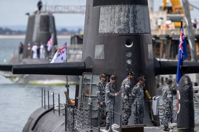 An Australian Collins class submarine is parked in front of the UK nuclear-powered attack submarine, HMS Astute in Perth. EPA