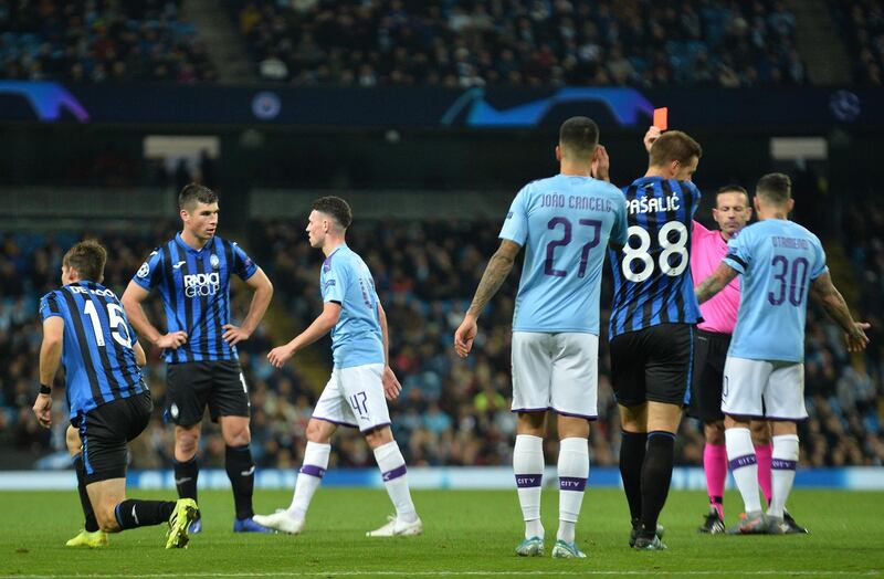 Manchester City's Phil Foden receives a red card. EPA