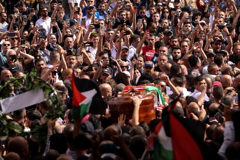 Family and friends carry the coffin during the funeral. Reuters