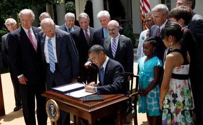 FILE - In this Monday, June 22, 2009 file photo, President Barack Obama, joined by members of Congress and others, signs the Family Smoking Prevention and Tobacco Control Act, during a ceremony in the Rose Garden of the White House in Washington. â€œThe decades-long effort to protect our children from the harmful effects of smoking has finally emerged victorious,â€ Obama declared in a speech before signing the measure into law. (AP Photo/Pablo Martinez Monsivais)