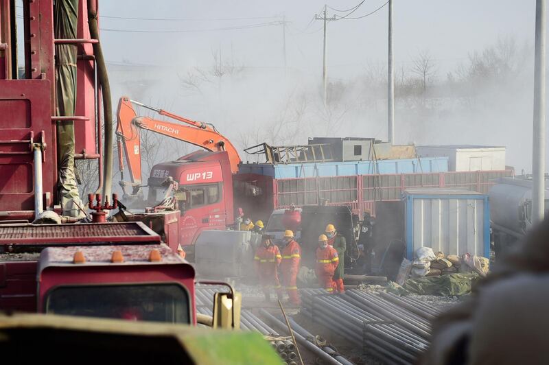 Rescuers working at the site of gold mine explosion where 22 miners were trapped underground in Qixia, in eastern China's Shandong province. Miners trapped underground in eastern China for more than a week after a blast at a gold mine have managed to send up a note to rescuers, the local government said on January 18.  AFP