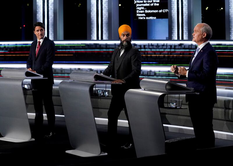 From left, Liberal leader Justin Trudeau, NDP leader Jagmeet Singh and Conservative leader Erin O'Toole take part in the federal election English-language leaders' debate. Reuters