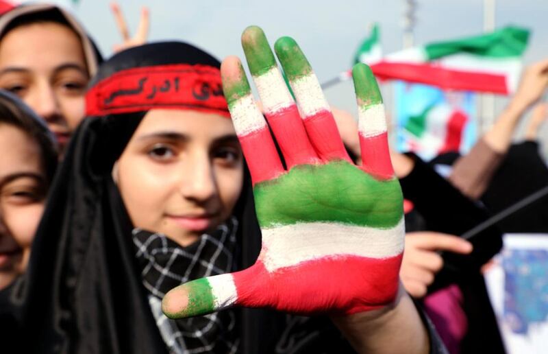 An Iranian girl shows her hand painted with Iran's national flag during a ceremony marking the 35th anniversary of the 1979 Islamic revolution, at the Azadi (Freedom) square in Tehran on February 11, 2014. Abedin Taherkenareh/EPA