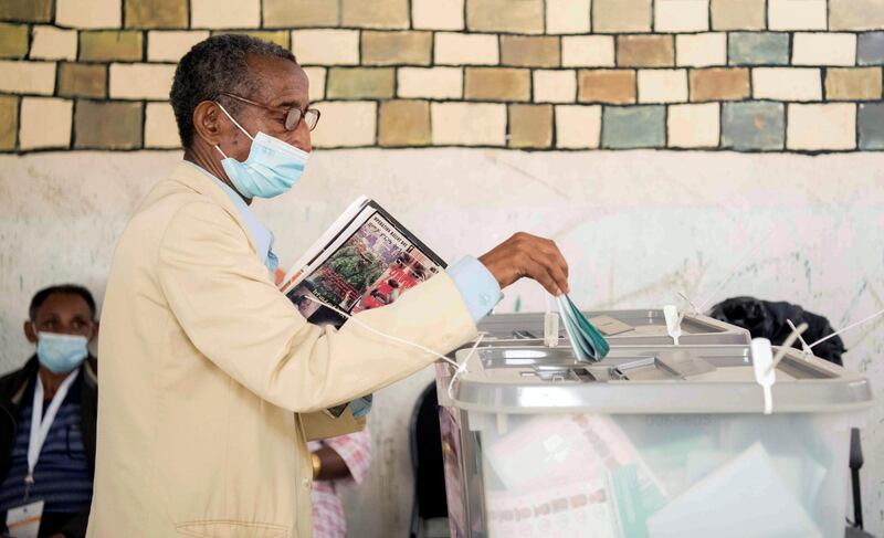 Ayalew Wedajo, 60, casts his ballot inside a polling station in Addis Ababa, Ethiopia. Reuters