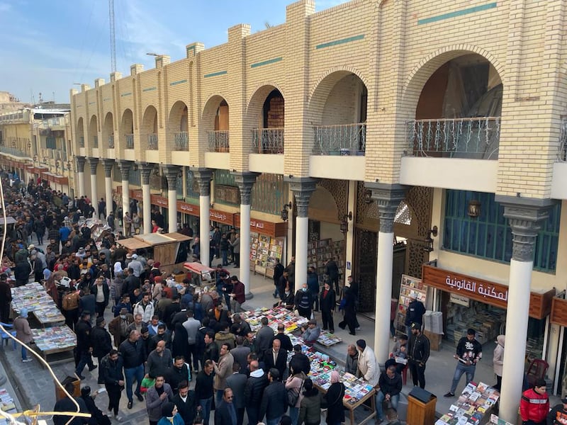 People visit Al Mutanabbi Street to buy books, watch arts performances and celebrate festivals.