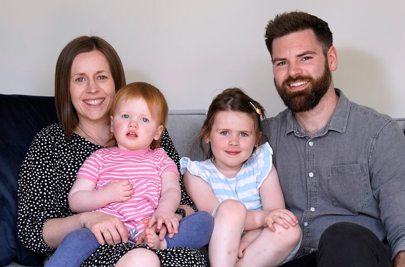 Opal Sandy, second left, who received ground-breaking gene therapy aged 11 months, is pictured with her mother Jo, father James and sister Nora at their home in Eynsham, Oxfordshire. PA