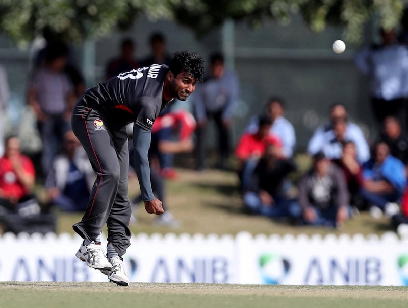 Dubai, United Arab Emirates - January 26, 2019: Amir Hayat of the UAE bowls in the the match between the UAE and Nepal in a one day internationl. Saturday, January 26th, 2019 at ICC, Dubai. Chris Whiteoak/The National