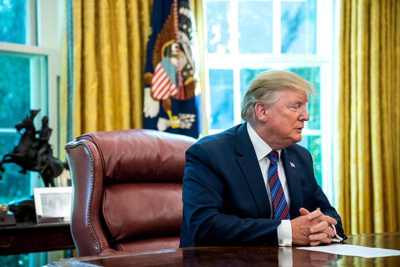 epa07743003 US President Donald J. Trump speaks to the media after reaching an asylum deal with Guatemala in the Oval Office of the White House in Washington, DC, USA, 26 July 2019. The president also spoke about Mueller's testimony before Congress, taxing French wine, and the North Korean missile launch, among other issues.  EPA/JIM LO SCALZO