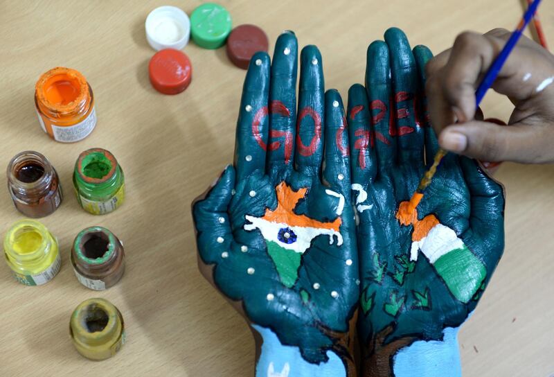 An Indian student gets her palms painted ahead of Indian Independence Day celebrations in Chennai. Arun Sankar/AFP