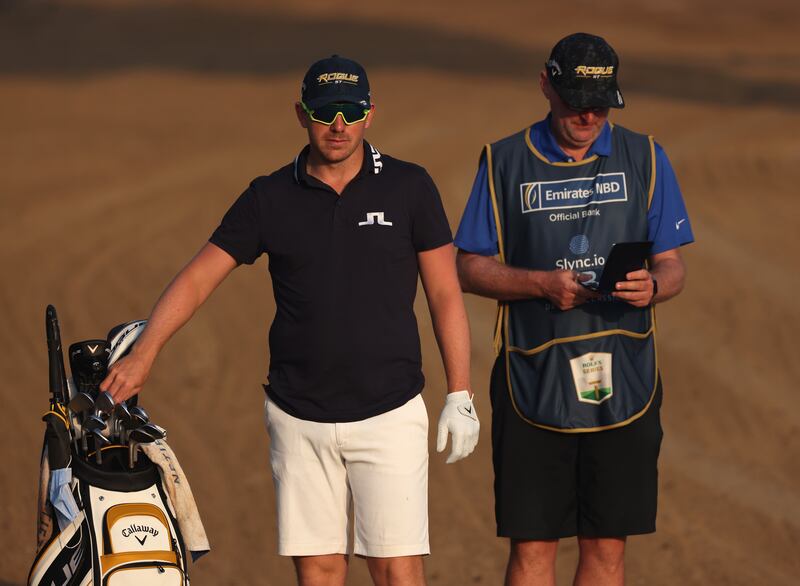 Matt Wallace of England ponders a shot during the pro-am prior to the Slync.io Dubai Desert Classic at Emirates Golf Club.